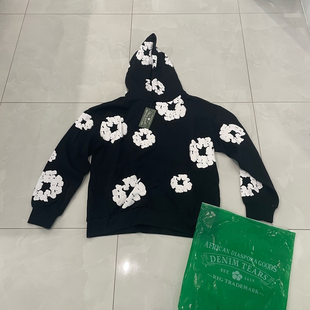 Denim Tears Black Hoodie with White Floral Design